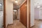 Hallway of an empty urban dwelling with oak parquet flooring