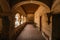 Hallway in a former 17th century Convent in central Mexico, with details of worn paint on the quarry walls and huge white arches.