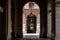 Hallway with geometric columns and diminishing perspective. Walkway arch style. Outdoor dining