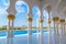 Hallway with golden decorated pillars at the entrance of the world famous Sheikh Sultan Zayed Mosque in Abu Dhabi UAE