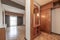 Hallway of a house with oak wood flooring, built-in wardrobes