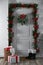 Hallway interior with decorated door and Christmas gifts