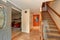 Hallway interior with staircase and red contrast wall.