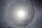 The halo is a circle around the sun as a rare natural phenomenon in the sky.