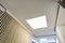 Halogen spots lamps on suspended ceiling and drywall construction in in empty room in apartment or house. Stretch ceiling white