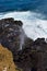 Halona Blowhole spraying water through its lava tube