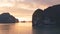 Halong bay at golden sunrise in Vietnam, South Asia. Panoramic view. Travel destination and natural background