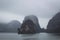 Halong Bay in mystical clouds. Mystical atmoshpere in the world famous halong bay.