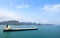 Halong Bay, Vietnam. Cargo freighter surrounded by Limestone Islands