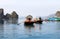 Halong Bay, Vietnam. tourist on row boats visiting floating fishing village