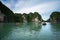 Halong bay in Vietnam, UNESCO World Heritage Site, with tourist rowing boats