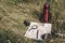 Halt to rest. Map, magnifier, binoculars, pen, glasses and a thermos in the grass.