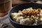 Halusky as traditional Slovak potato gnocchi with sheep cheese bryndza, fried bacon and chives