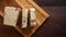 Halva cocoa tahini slices on wooden table background, top view