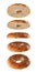 Halved bagel tops flying on white background