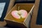 Halved ellow apple in a wooden box.