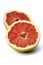 Halved grapefruit on white background