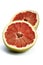 Halved grapefruit on white background