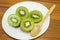 Halved kiwis on a white plate