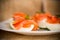 Halves of boiled eggs with pieces of salted salmon