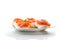 Halves of boiled eggs with pieces of salted salmon on white background