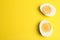 Halves of fresh hard boiled chicken egg on background, flat lay. Space for text