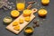 Halves of orange on cutting board