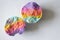 Halves rainbow bath bombs on white