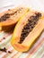 Halves of ripe orange papaya
