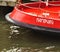 Hamburg city name sign on a red ship stern