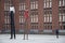 Hamburg, Germany 07-12-2015 A man looks at his phone near two striking long-legged statues.
