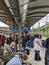 Hamburg, Germany 13.5.2022 Annoyed passengers waiting for delayed trains in Germany. Crowded train platform full of people waiting