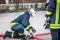 Hamburg, Germany - April 18, 2013: HDR - firefighter in action and connects two fire hoses