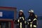 Hamburg, Germany - April 18, 2013: HDR - firefighter and firefighter in action with firehose