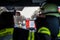 Hamburg, Germany - April 18, 2013: HDR - firefighter on the street in the fire truck in action