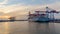 HAMBURG, GERMANY - Aug 08, 2020: Incredible seaside view of the container port in Hamburg at sunset