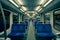 Hamburg, Germany - May 22, 2018: empty seats of modern high speed commuter metro train, night lights turned on