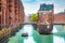 Hamburg Speicherstadt warehouse district with sightseeing boat