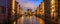 Hamburg Wasserschloss Castle Speicherstadt panoramic view at night in Germany