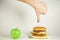 Hamburger or Apple, fast food or healthy food, what to choose