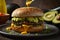 a hamburger with avocado sauce on it and avocado on the plate Avocado Bliss Crafting the Perfect Ch