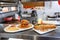 Hamburger and baguette with salmon on plates