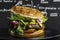 Hamburger on a black background in a studio.