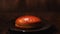 Hamburger buns in a black glass plate standing on the wooden table and water vapor on the background. Stock footage