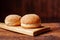 Hamburger buns. Sesame seeds on top. Wooden background. Food concept