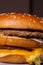 Hamburger, details of two gourmet double burgers, on wooden background, selective focus