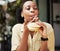 Hamburger, fast food and black woman eating a brunch in an outdoor restaurant as a lunch meal craving deal. Breakfast