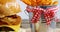 Hamburger french with fries in bucket kept on table