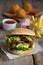 Hamburger with french fries and fried balls