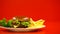 Hamburger with french fries and lettuce lying in plate, fast food restaurant